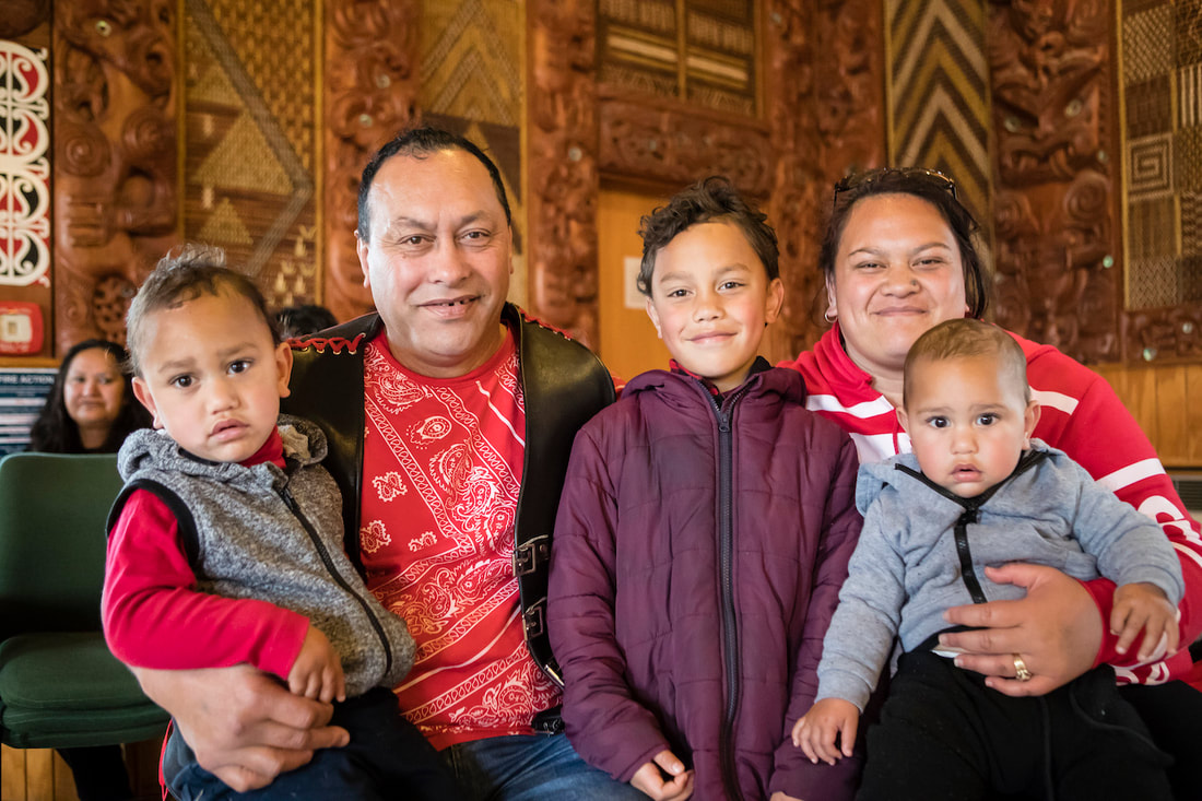 A young Maori family at a hui