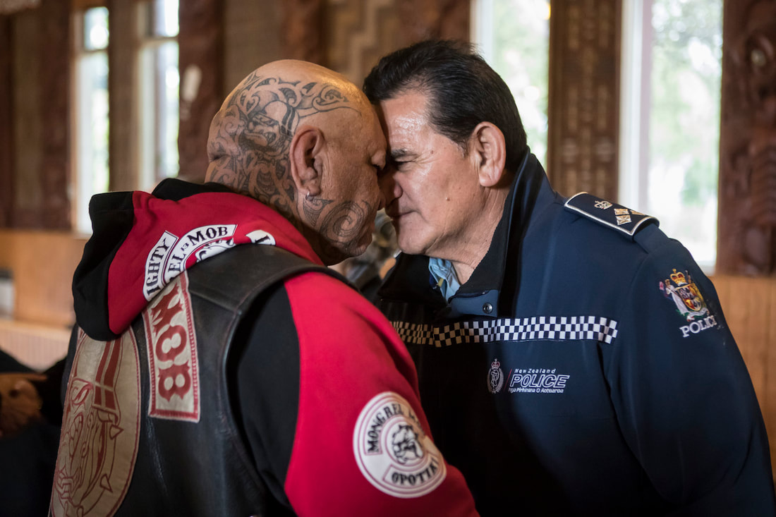 a Hongi between a Mongrel Mob member and a Police Officer